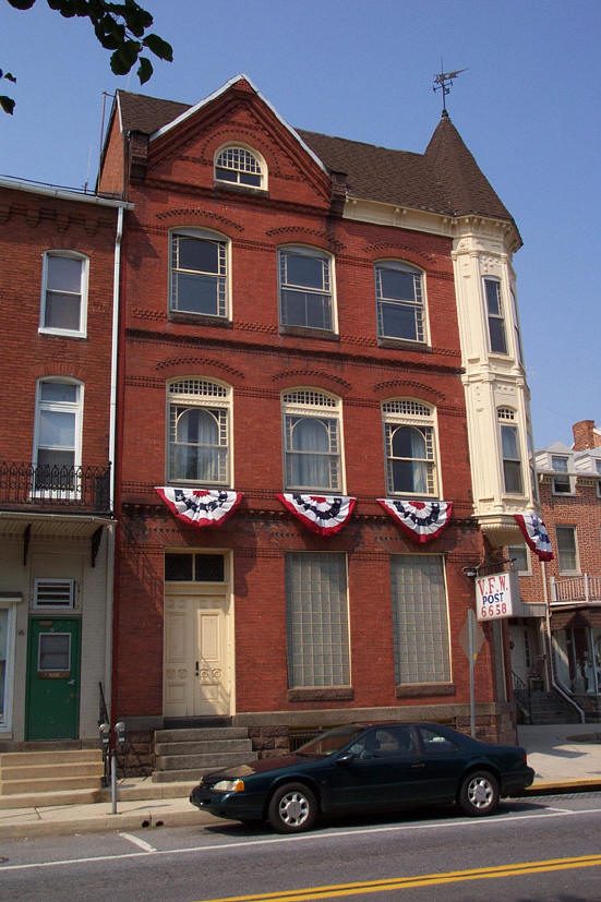 The Post building on Main Street dressed with patriotic bunting and its VFW Post 6658 sign